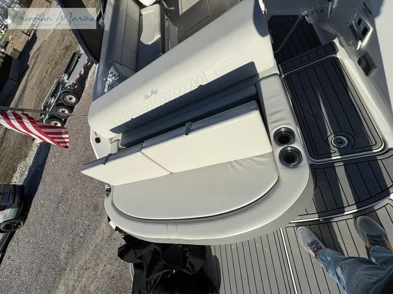 Slide: The Image of 2020 Sea Ray SLX 280 boat interior with seating and cup holders. - 16