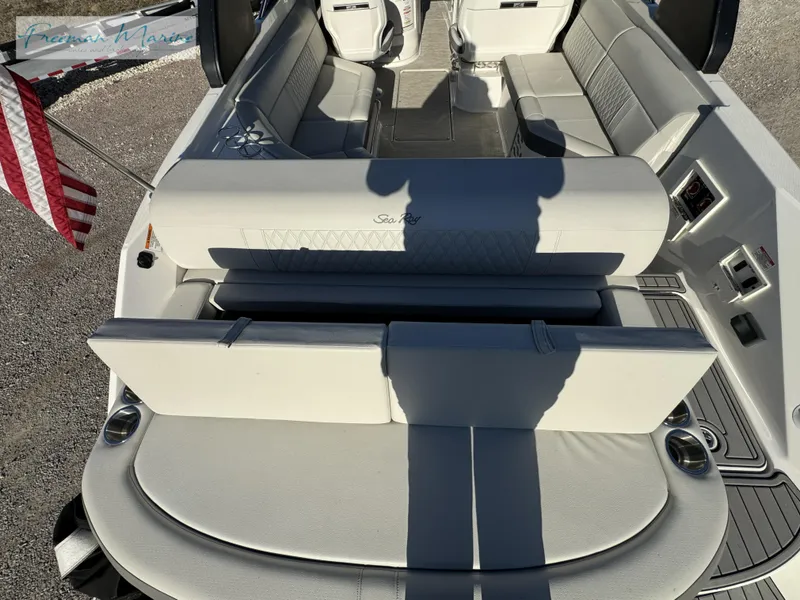 Slide: The Image of 2020 Sea Ray SLX 280 boat interior with seating and American flag. - 20