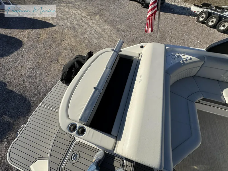 Slide: The Image of 2020 Sea Ray SLX 280 boat interior with seating and American flag. - 21