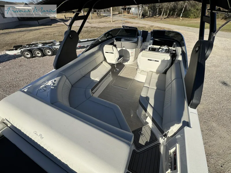 Slide: The Image of 2020 Sea Ray SLX 280 boat interior with spacious seating and modern design. - 22