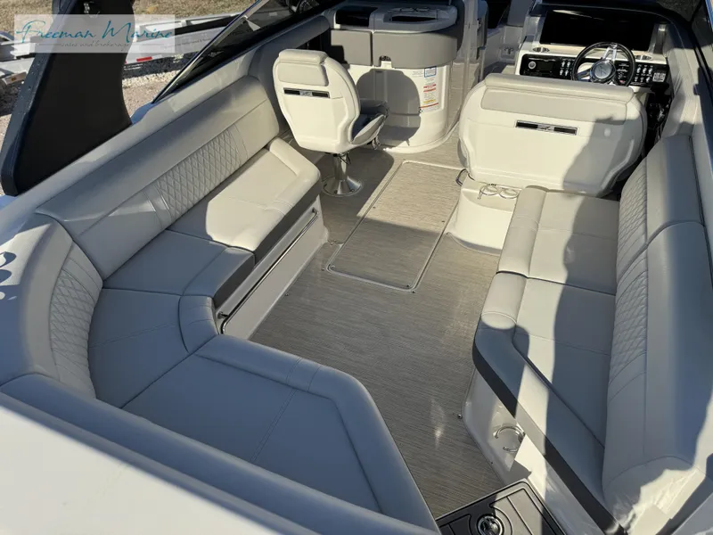 Slide: The Image of 2020 Sea Ray SLX 280 boat interior with spacious seating and modern design. - 23