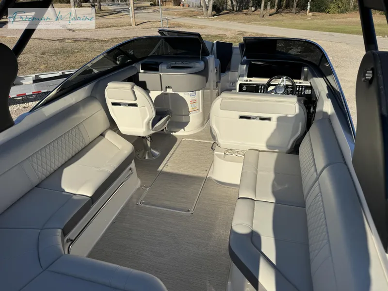 Slide: The Image of 2020 Sea Ray SLX 280 boat interior with luxurious seating and modern dashboard. - 24