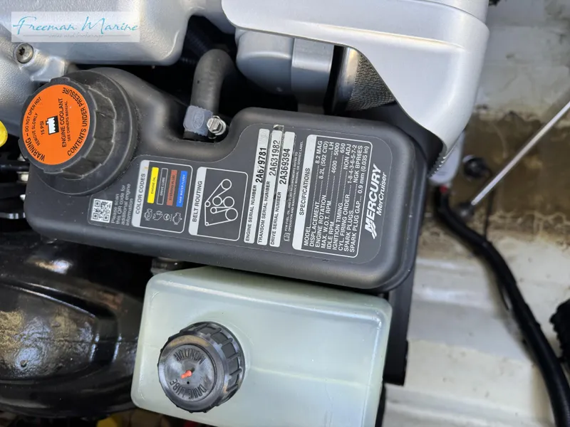 Slide: The Image of Engine compartment of a 2020 Sea Ray SLX 280 boat, featuring Mercury components. - 33