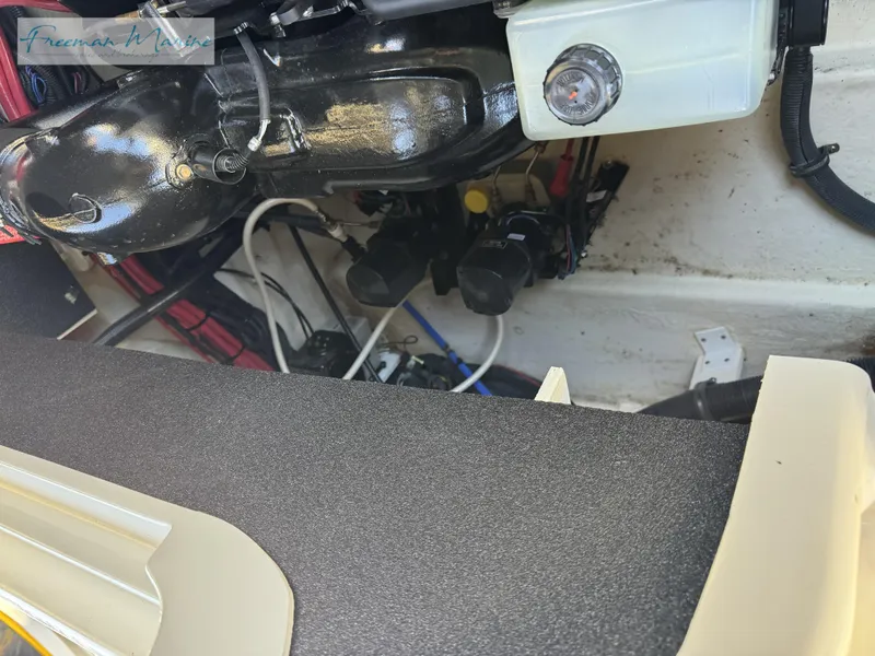 Slide: The Image of Engine compartment of a 2020 Sea Ray SLX 280 boat, showing mechanical components. - 34