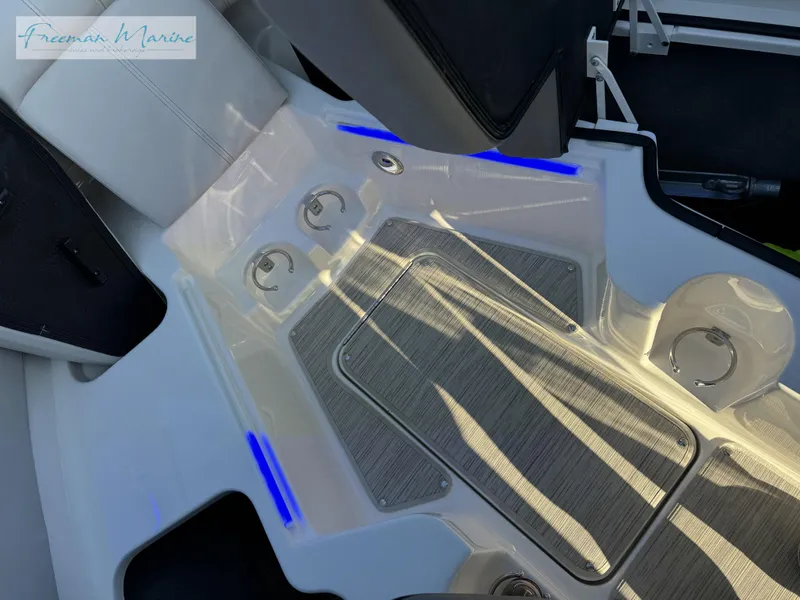 Slide: The Image of 2020 Sea Ray SLX 280 boat interior with sleek design and blue LED accents. - 37