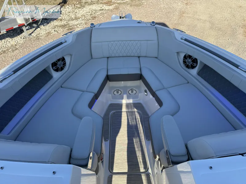 Slide: The Image of 2020 Sea Ray SLX 280 boat interior with gray seating and cup holders. - 38