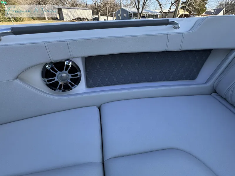 Slide: The Image of 2020 Sea Ray SLX 280 boat interior with speaker and cushioned seating. - 40