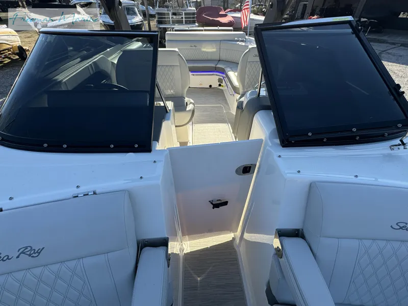 Slide: The Image of 2020 Sea Ray SLX 280 boat interior with white seating and open deck layout. - 41