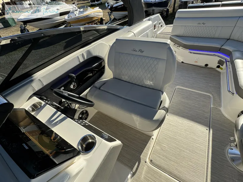 Slide: The Image of 2020 Sea Ray SLX 280 boat interior with luxurious seating and modern dashboard. - 45