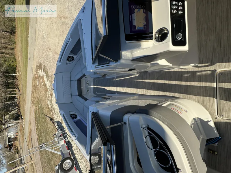 Slide: The Image of 2020 Sea Ray SLX 280 boat interior with navigation system and seating area. - 46