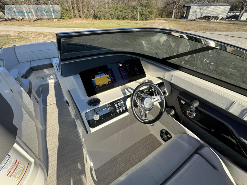 Slide: The Image of 2020 Sea Ray SLX 280 boat interior with modern dashboard and steering wheel. - 47