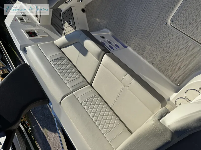 Slide: The Image of 2020 Sea Ray SLX 280 boat interior with cushioned seating and modern design. - 48