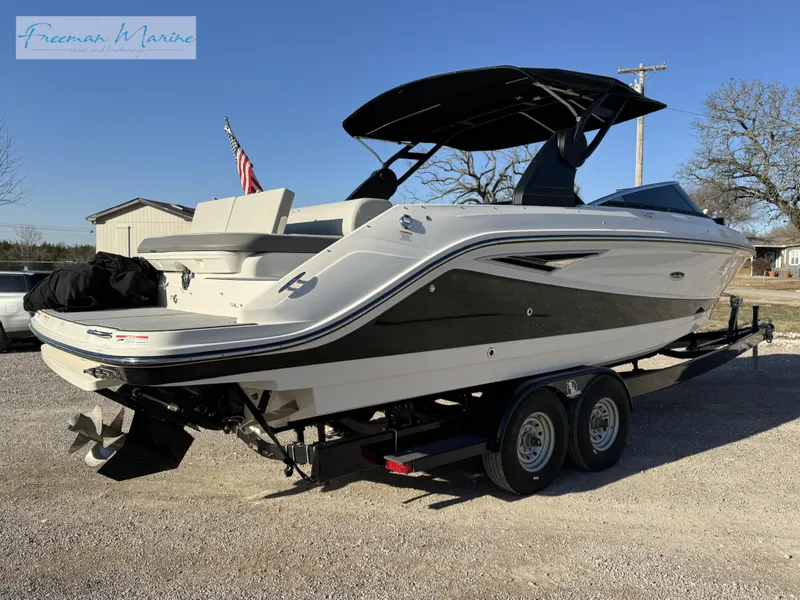 Slide: The Image of 2020 Sea Ray SLX 280 boat on trailer, parked outdoors. - 5