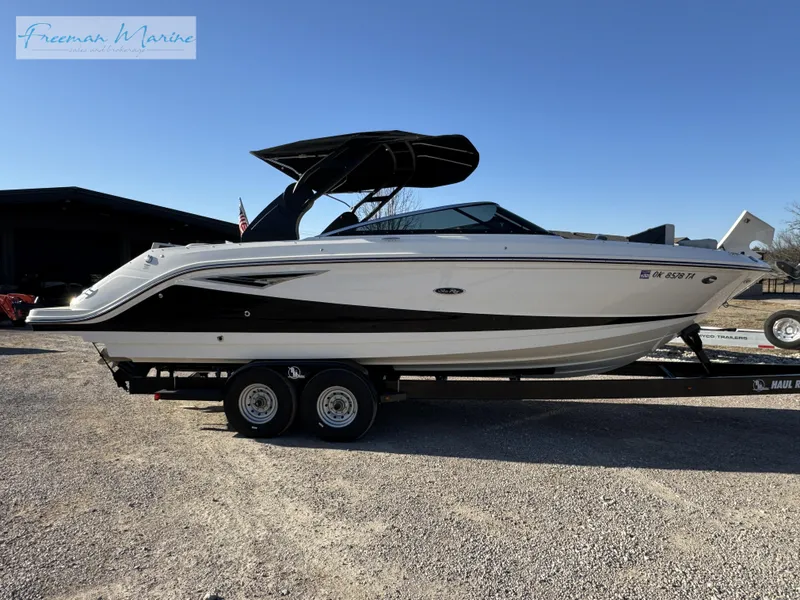 Slide: The Image of 2020 Sea Ray SLX 280 boat on trailer, side view, outdoors. - 6