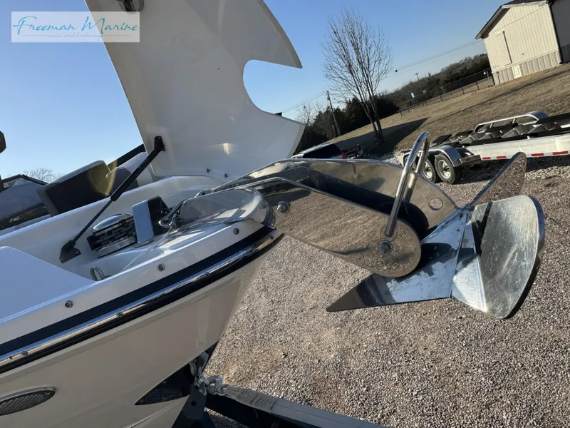 Slide: The Image of 2020 Sea Ray SLX 280 boat anchor detail in a sunny outdoor setting. - 7