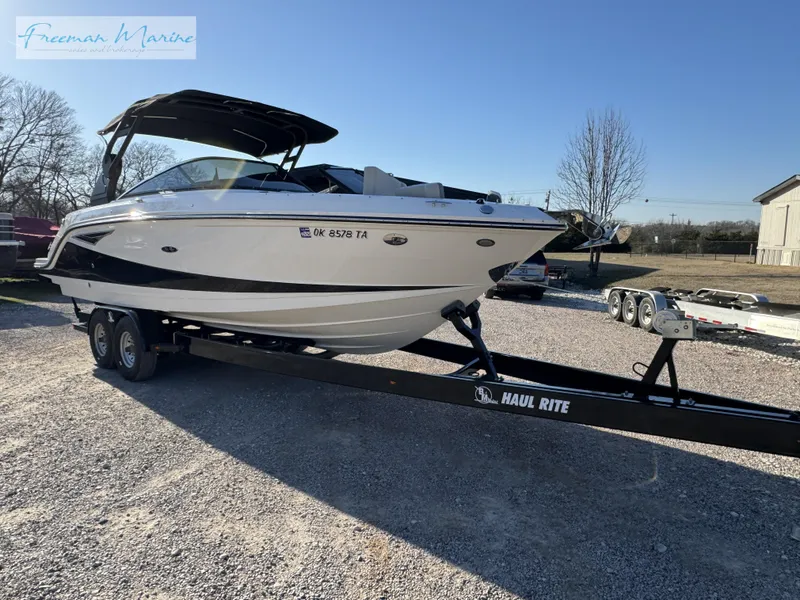 Slide: The Image of 2020 Sea Ray SLX 280 boat on trailer in outdoor setting. - 8