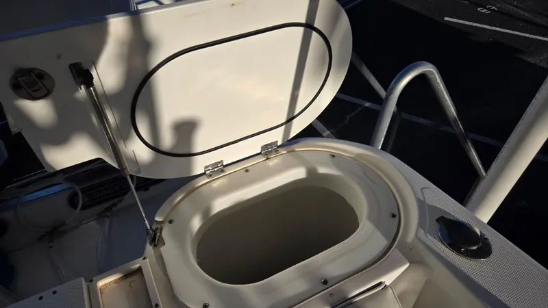 Slide: The Image of Open hatch on 2006 Wellcraft 352 Sport boat, showing storage compartment. - 10