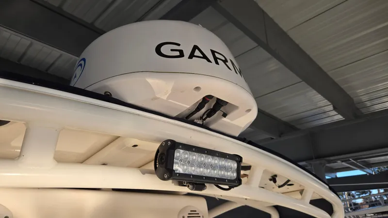 Slide: The Image of Radar and light on 2006 Wellcraft 352 Sport boat under a metal roof. - 11