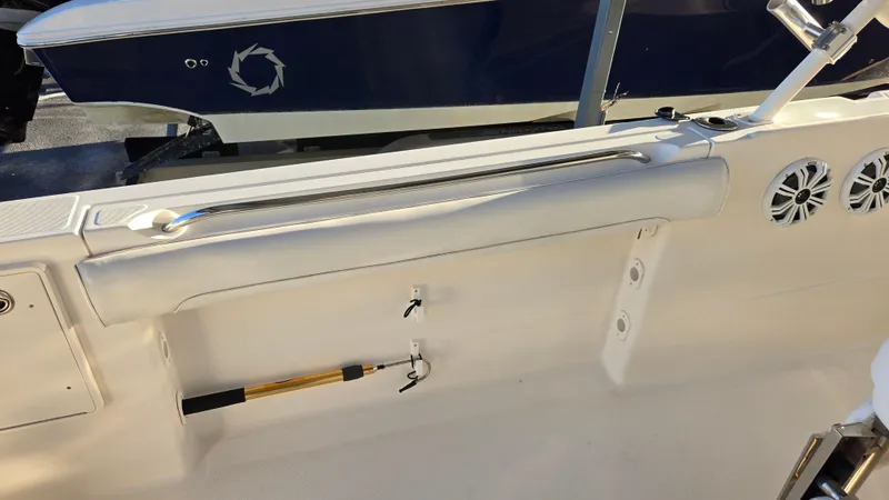 Slide: The Image of 2006 Wellcraft 352 Sport boat interior with white seating and mounted accessories. - 15