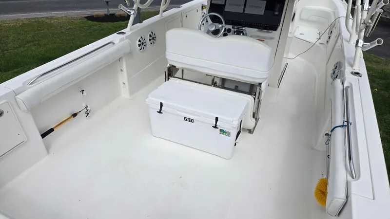Slide: The Image of 2006 Wellcraft 352 Sport Scarab boat interior with seating and cooler. - 16