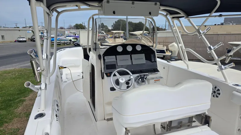 Slide: The Image of 2006 Wellcraft 352 Sport Scarab boat interior with steering wheel and control panel. - 18