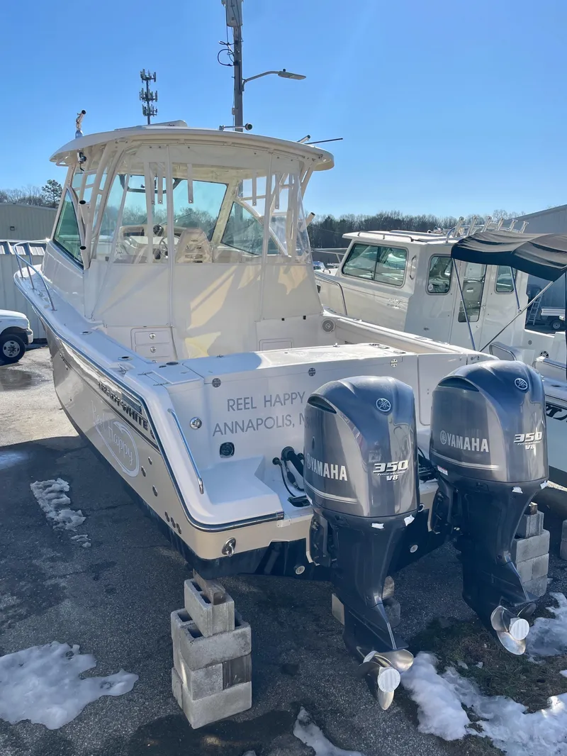 Slide: The Image of 2015 Grady-White Express 330 boat with twin Yamaha 350 engines, docked in Annapolis. - 11