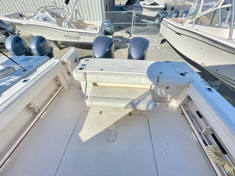 Slide: The Image of 2015 Grady-White Express 330 boat deck with dual outboard motors. - 14