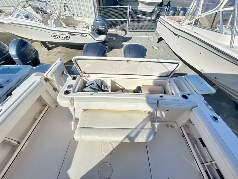 Slide: The Image of 2015 Grady-White Express 330 boat interior with open storage compartment. - 15