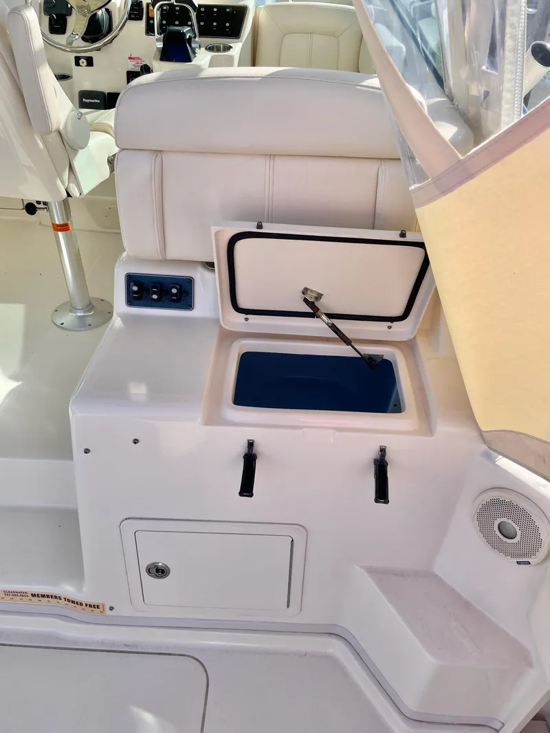 Slide: The Image of 2015 Grady-White Express 330 boat interior with open storage compartment. - 21