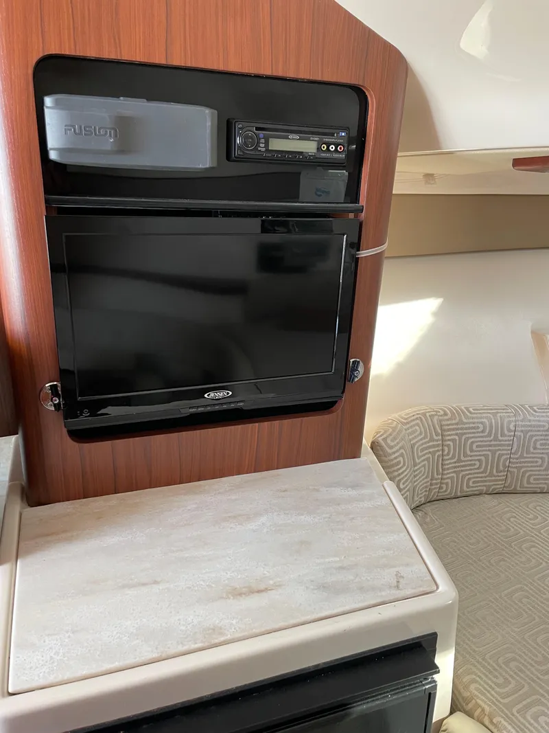 Slide: The Image of Interior of 2015 Grady-White Express 330 with TV and audio system. - 34