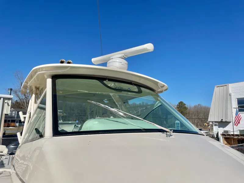 Slide: The Image of 2015 Grady-White Express 330 boat with radar, clear sky background. - 8