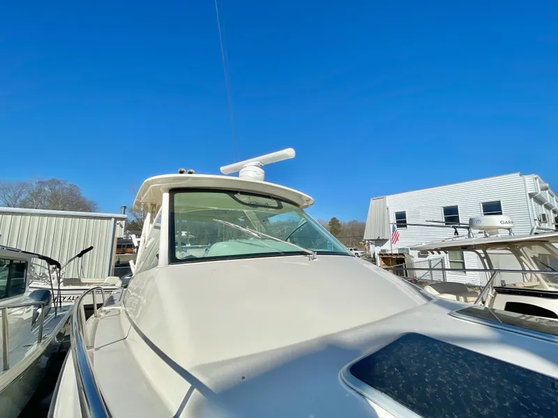 Slide: The Image of 2015 Grady-White Express 330 boat docked under clear blue sky. - 9
