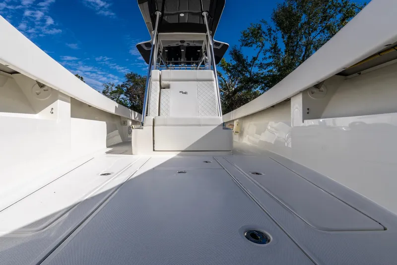 Slide: The Image of 2019 SeaVee 322z boat interior with sleek design and spacious deck. - 17