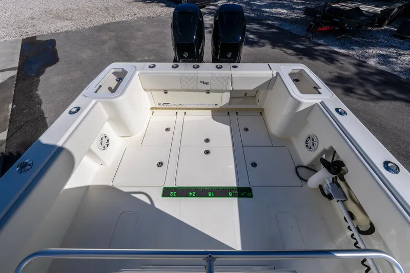 Slide: The Image of 2019 SeaVee 322z boat deck with dual engines, spacious layout, and fishing features. - 22
