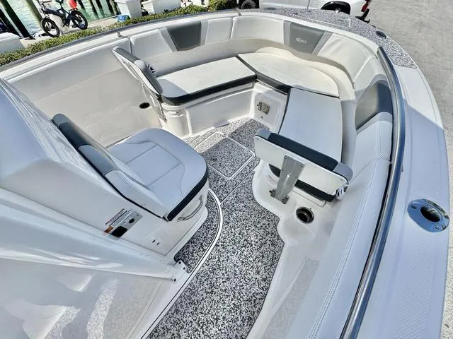 Slide: The Image of 2023 Robalo R230 boat interior with spacious seating and modern design. - 12