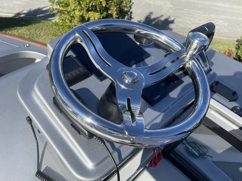 Slide: The Image of Chrome steering wheel on a 2020 Stuart 27 CC boat. - 14