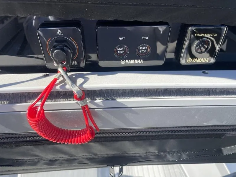 Slide: The Image of Control panel of a 2020 Stuart 27 CC boat with Yamaha start/stop buttons. - 15
