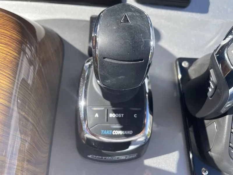 Slide: The Image of Boat throttle control of a 2020 Stuart 27 CC with "Take Command" label. - 21
