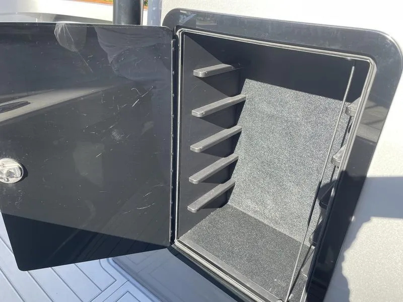 Slide: The Image of Open storage compartment on a 2020 Stuart 27 CC boat. - 22