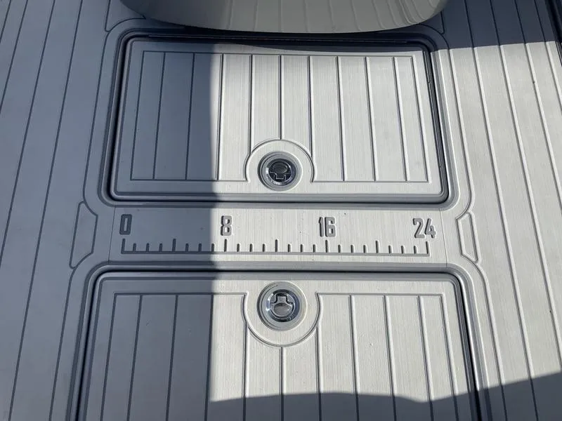 Slide: The Image of 2020 Stuart 27 CC boat deck with built-in ruler and storage compartments. - 31
