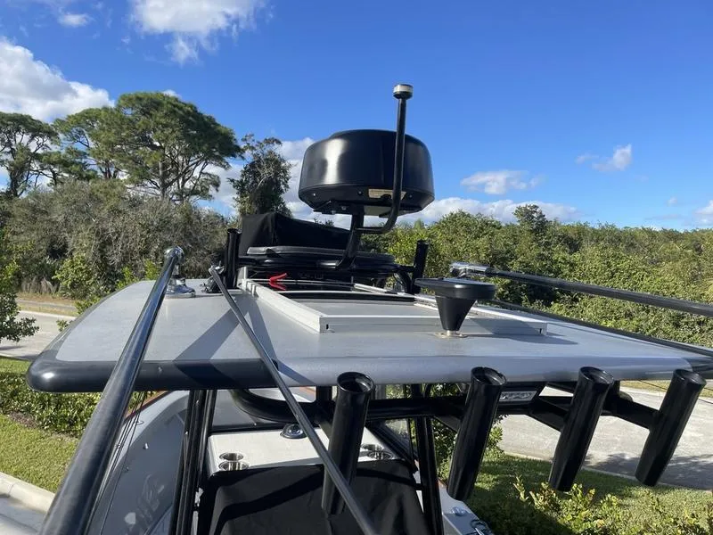 Slide: The Image of 2020 Stuart 27 CC boat with radar equipment under a clear blue sky. - 46