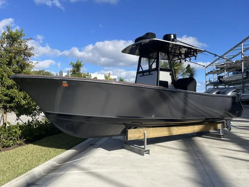 Slide: The Image of 2020 Stuart 27 CC boat on display under clear blue sky. - 49