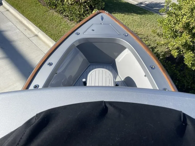 Slide: The Image of 2020 Stuart 27 CC boat bow view, showcasing sleek design and spacious deck area. - 8