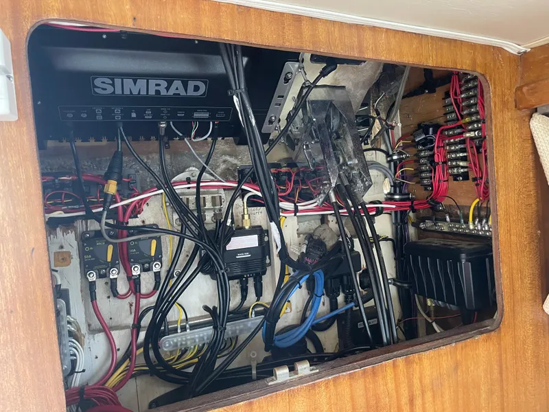 Slide: The Image of Electrical wiring and Simrad system inside a 1967 Hatteras 28 Cruiser boat. - 18
