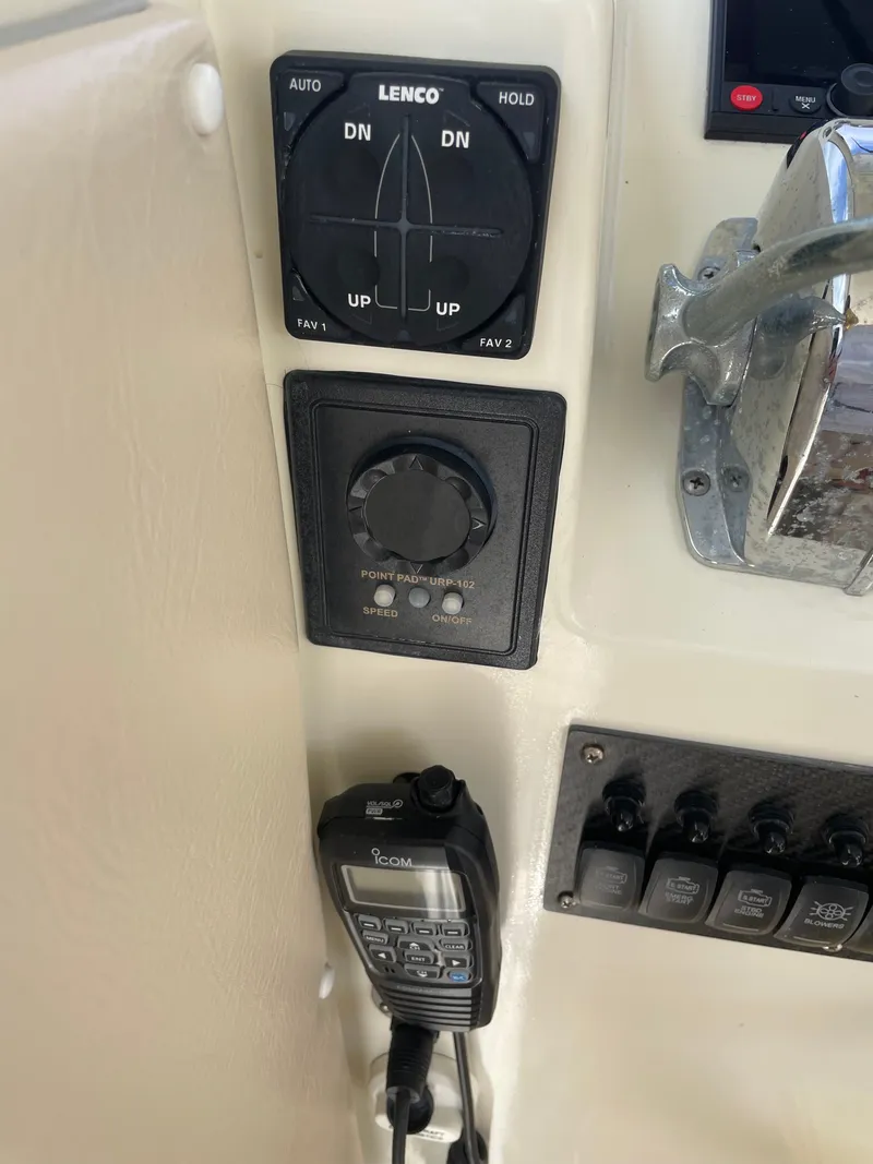 Slide: The Image of Control panel of a 1967 Hatteras 28 Cruiser boat with Lenco trim tab switch. - 31