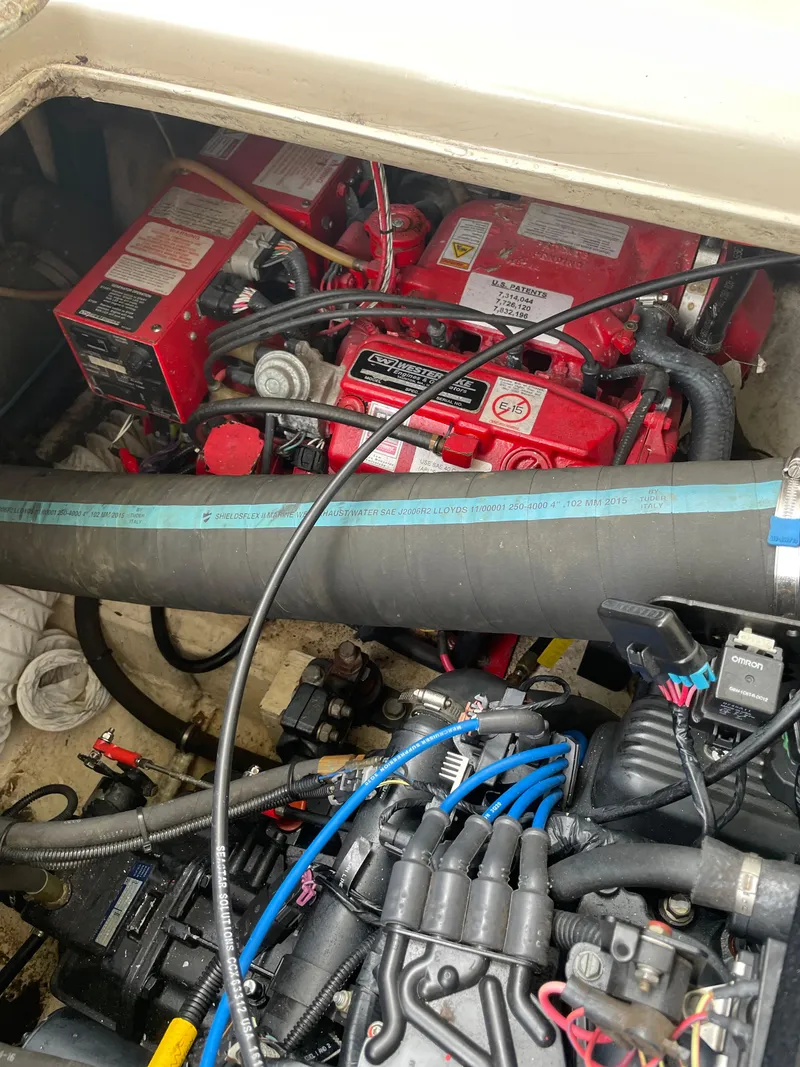Slide: The Image of Engine compartment of 1967 Hatteras 28 Cruiser with visible red components and wiring. - 45