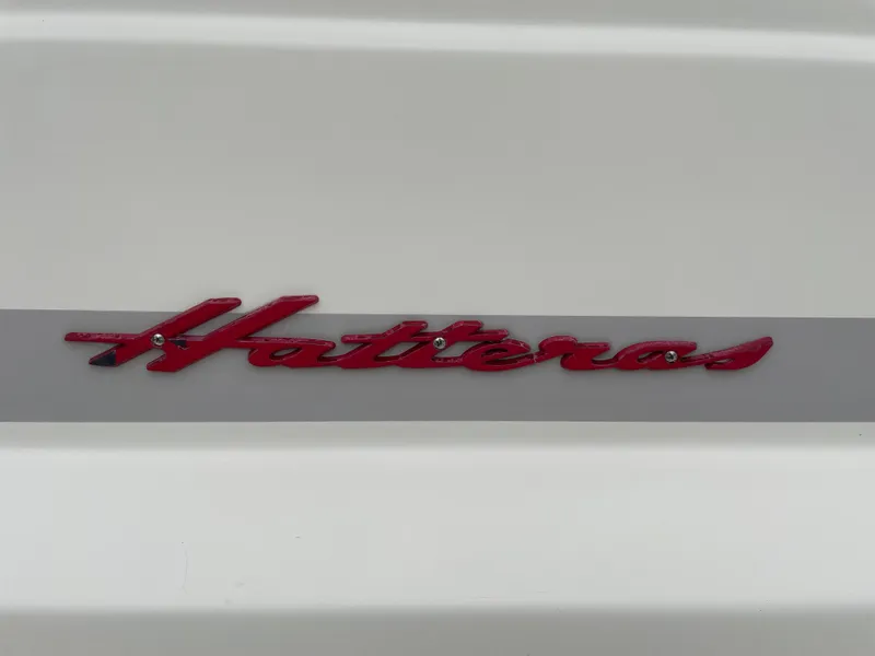 Slide: The Image of Red "Hatteras" logo on a 1967 Hatteras 28 Cruiser boat. - 46