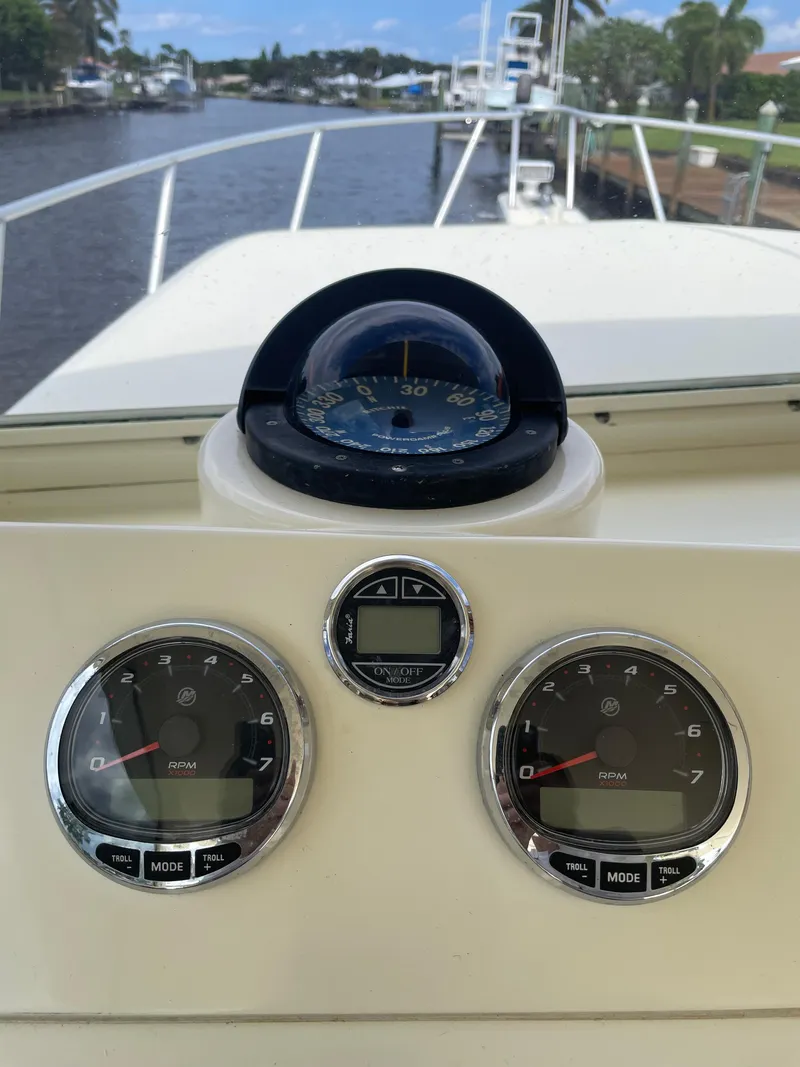 Slide: The Image of Dashboard of a 1967 Hatteras 28 Cruiser with compass and gauges. - 32