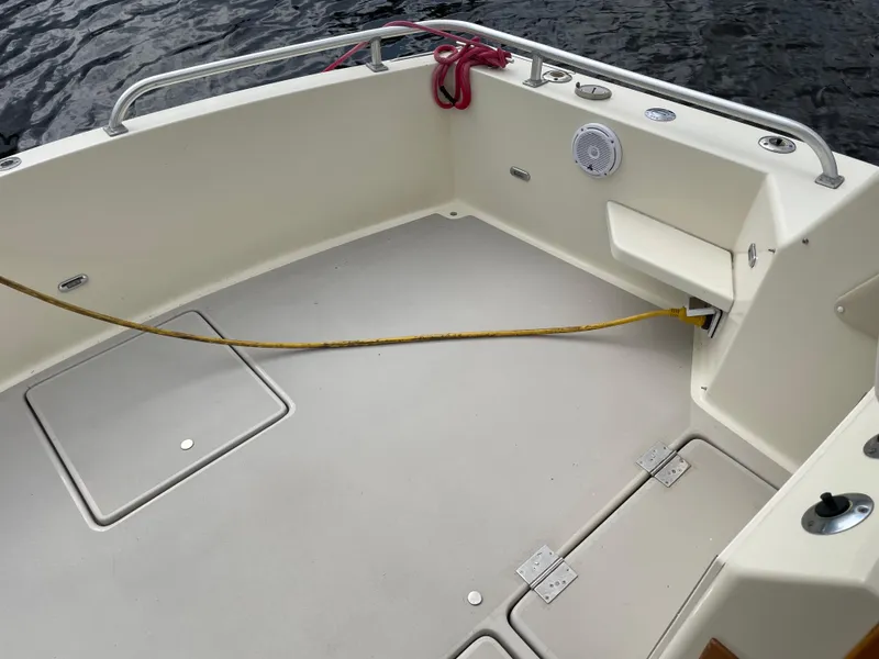 Slide: The Image of 1967 Hatteras 28 Cruiser boat deck with railing and storage compartments. - 39