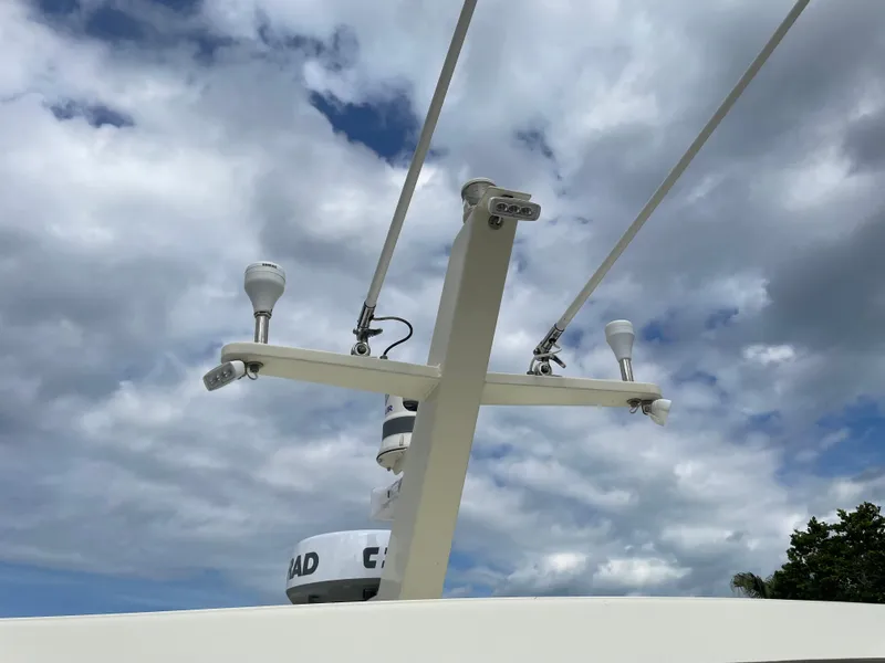 Slide: The Image of Radar and antennas on a 1967 Hatteras 28 Cruiser against a cloudy sky. - 41